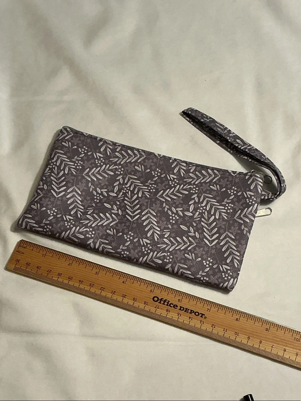 Cosmetics 5 pieces Brown Eyeliner & 3 shades of lip gloss w/ floral wristlet